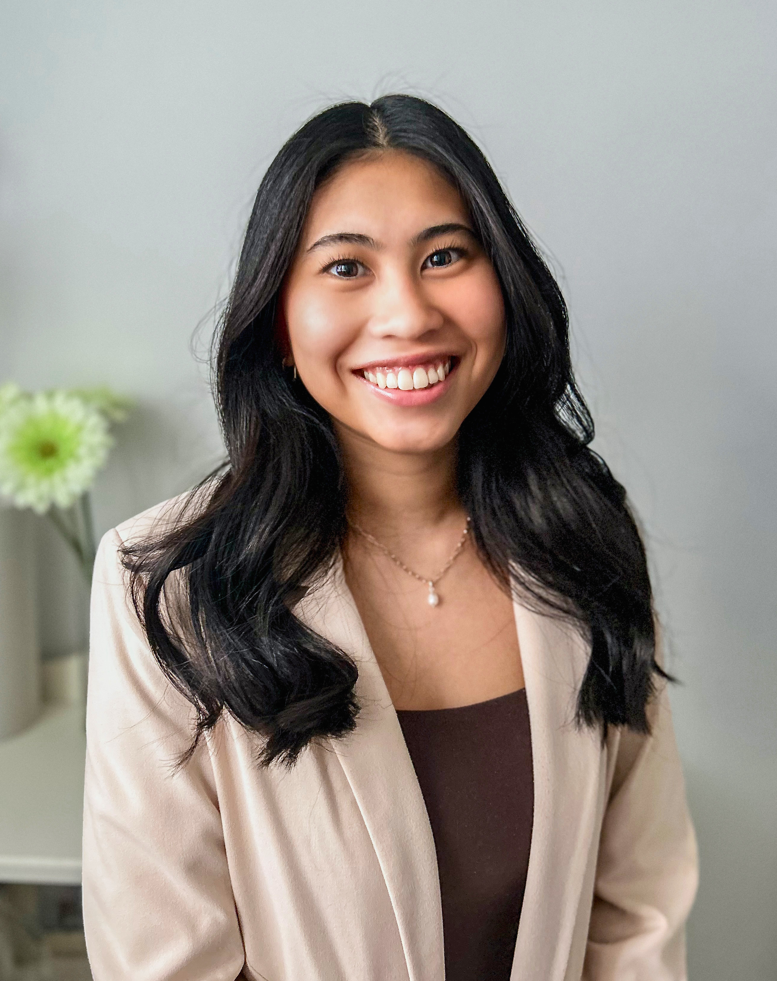 A headshot of Hannah Quintos.